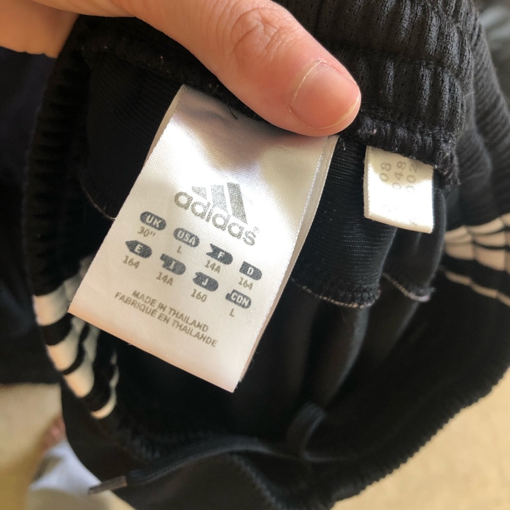 Black and white adidas pants